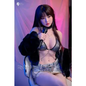 Gynoid 23R 156cm doll with long dark hair, black hooded jacket, metallic bikini top, denim skirt, and full-body fashion styling