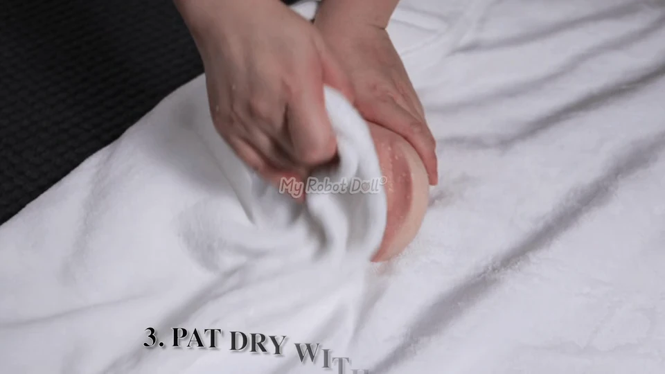 A Removable Insert Being Dried With A Towel