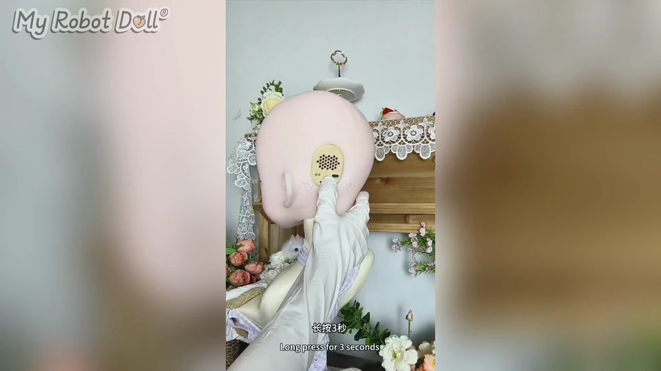 The Control Area At The Back Of An Elsa Babe Doll Head Is Shown During Setup.