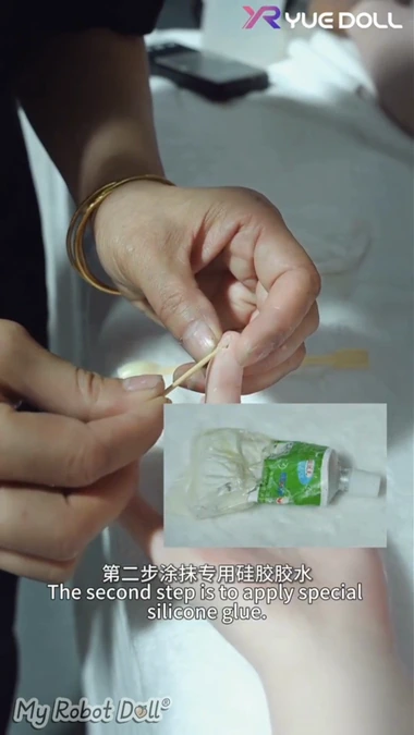Repair Material Is Applied To A Small Tear On A Silicone Doll Finger.