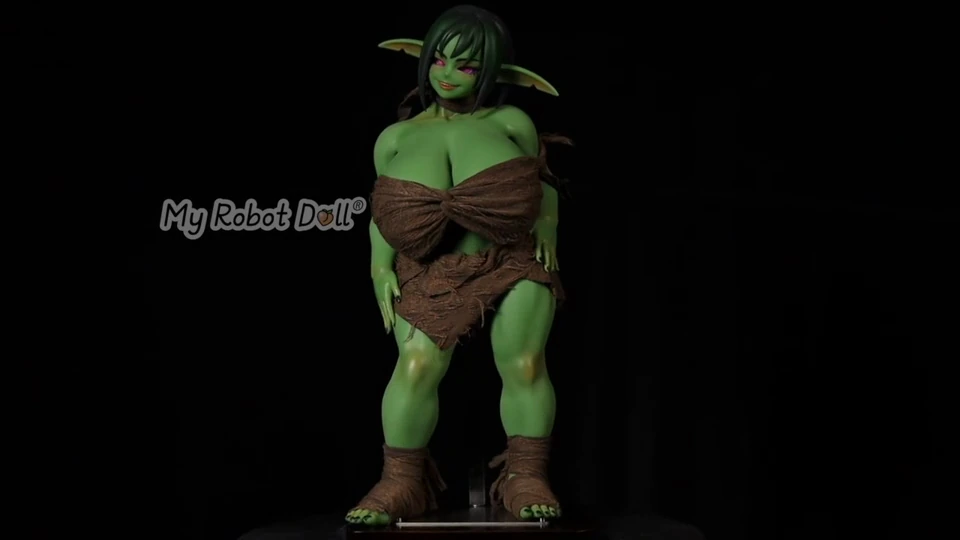 Clothed Green Fantasy Doll Shown At The Start Of The Dressing Demonstration.