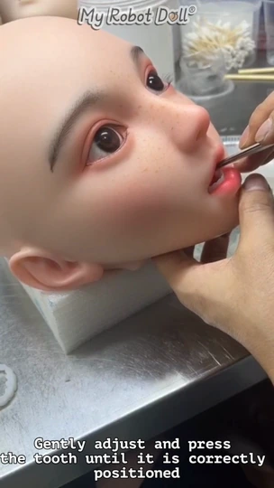 Close-Up Of A Doll Head During The Tayu Tooth Reattachment Demonstration.