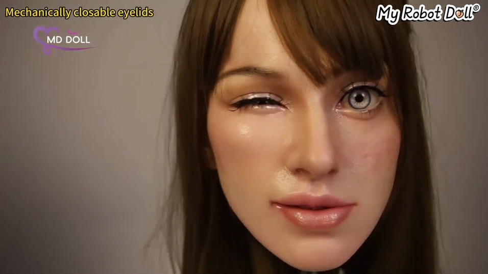 Md Doll Head With One Mechanical Eyelid Closed And The Other Eye Open.